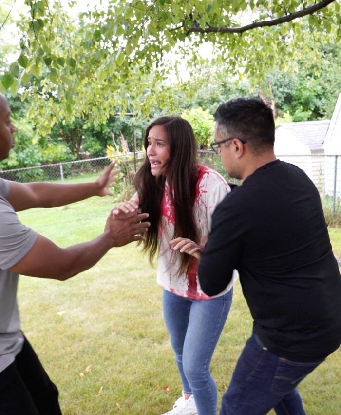 306595324_10160722255689973_4605063992876966197_n Jerry providing help to distressed woman with blood on shirt along with neighbor